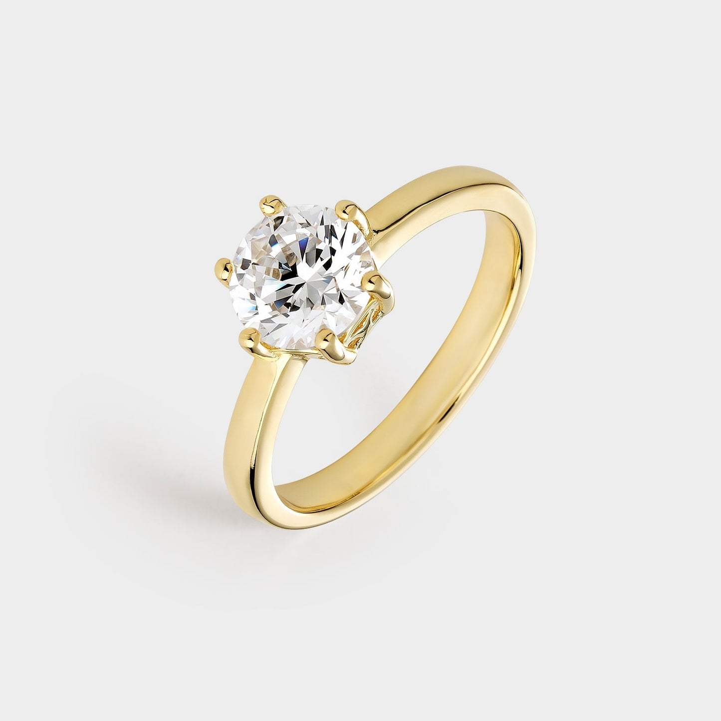 Anillo solitario de plata chapado en oro amarillo con circonita de 7 mm montada sobre 6 garras