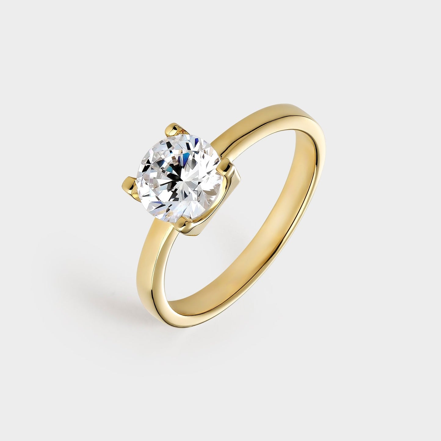 Anillo solitario de plata chapado en oro amarillo con circonita de 7 mm montada sobre 4 garras