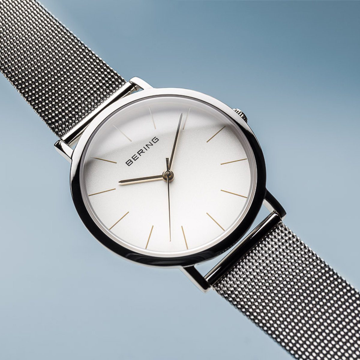 Reloj minimalista mujer plateado detalles dorados